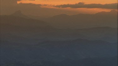 sunset over valley pan across could be sunrise