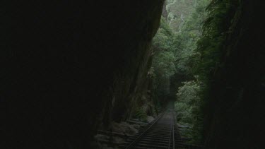 descending into dark tunnel