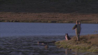 trout fishing at edge of Lake fly fishing