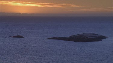 great evening light on the water some small rock islands exposed