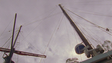 Pan over rigging of old fashioned square rigger sailing boat. Masts made of celery top pine.