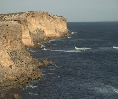 Coastal cliffs, erosion. waves.