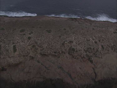 View around a large rock in the ocean