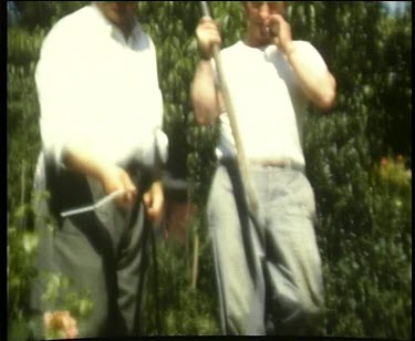 Men gardening in front yard