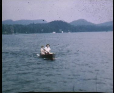 Mother and son in motorboat