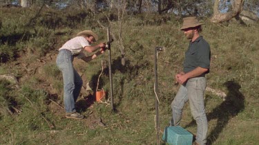 Man and women setting up horse counter