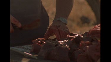 Close Up of Man's Hands Preparing Meat