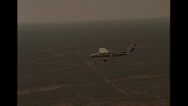 Small Aircraft Flying Over Australian Outback