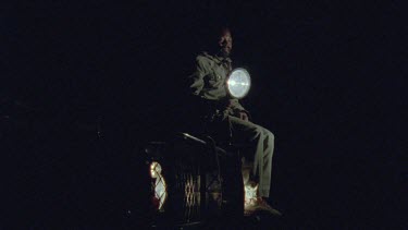 Tracker Elias Mathabula spotlighting from top of vehicle