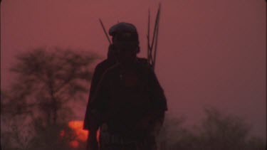 bushman hunters in sunset