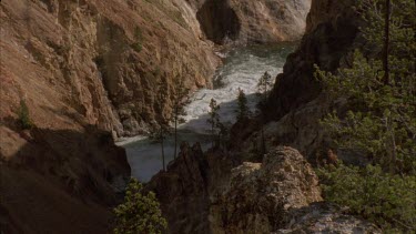 white water rapids flowing through deep river canyon