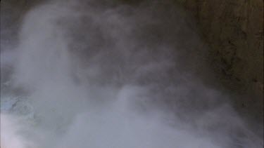 detail of waterfall spray, Smokey mist billowing across the screen