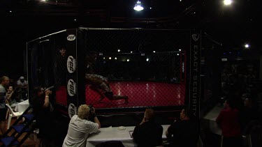 Fighters in a full-contact fighting match in a ring
