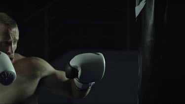 Man 2 punching bag  from left of frame Slo mo_MCU_ T1