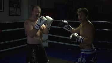 2 dangerous Boxing,Man on right punch and kicks man on left