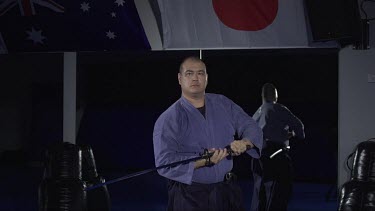 Man blocking with samuri sword_Slo Mo