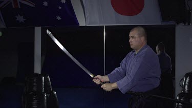 Man striking down with samuri sword_Profile_WS_Slo Mo_T2
