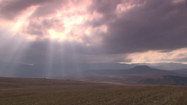 WS landscape sun shafts light spiritual sunburst clouds barren arid open plains savannah mountains