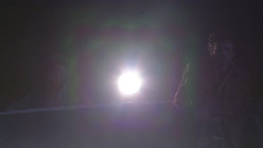 truck four wheel drive vehicle dark night spotlight torch searching scanning rangers humans
