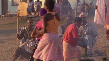 villagers local tribe woman children family clapping dancing rejoicing festivities gathering campfire day