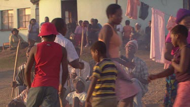 villagers local tribe woman children family clapping dancing rejoicing festivities gathering campfire day