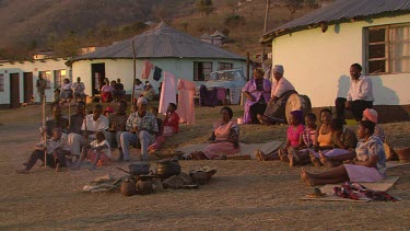 villagers local tribe woman children family clapping dancing rejoicing festivities gathering campfire day