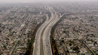 Los Angeles; LA. Multi-laned Highways. Spaghetti junctions. Roads, traffic, dust and air pollution. Smog. The Valley.