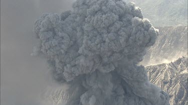 Close up of volcano volcanic vent with smoke rising.