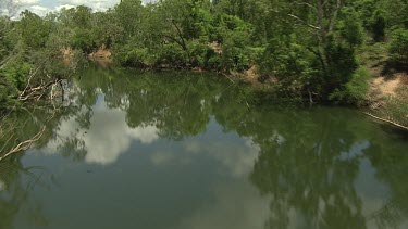 River, Northern Territory. Very green and lush. Reflections of clouds.