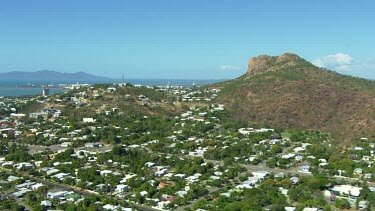 Townsville, Queensland. Over summit of Castle hill towards port, marina. Container ships in port