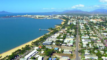 Townsville, beach pier, hotels. Tropical beach with palms. "The Strand".