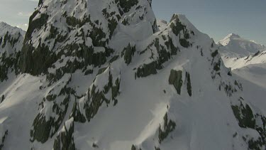 White snow mountain peaks, summit. Rocks. Medium Shot.