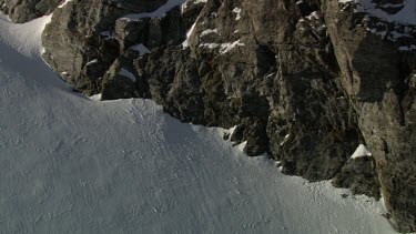 Aerial of Mount Everest: Climber resting on peak and viewing the scenery
