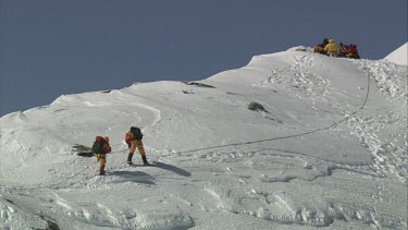 Aerial of Mount Everest: Group of Climbers - Two climbers are still climbing