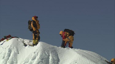 Aerial of Mount Everest: Group of Climbers on peak - Shaking hands and celebrating