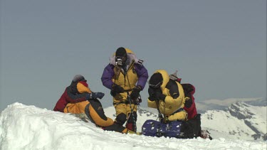 Aerial of Mount Everest: Group of Climbers resting, checking gear and leaving