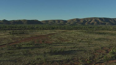 Aerial -Kimberley Region - 4WD on dirt road driving in BG
