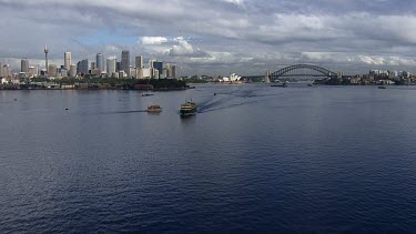 Aerial - Sydney - Port Jackson - Ferries - View of Sydney City, Harbour Bridge and Opera House