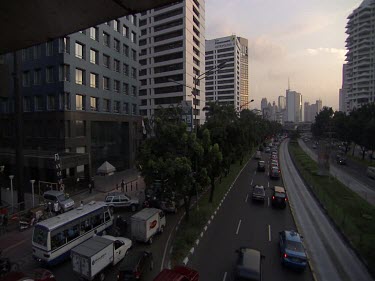 Jakarta evening. Dusk. Traffic. Cars driving. Rush hour