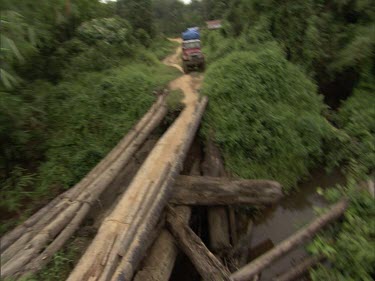 Sumatra forest four-wheel drive 4x4 drive over log bridge
