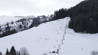 Time lapse of people skiing down a mountain in the French alpine village of Notre Dame de Bellecombe