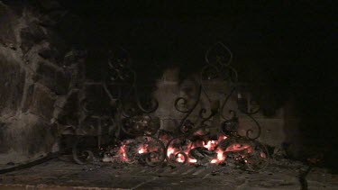 Wood glowing in a fireplace