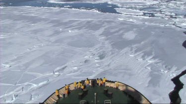High angle looking down on prow of Russian ice-breaker sailing and breaking the ice in the Weddell Sea, Antarctica. The ice cracks and drifts apart.