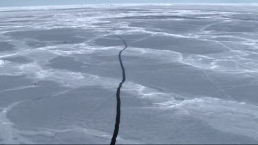 Aerial view of the sea ice on Antarctica breaking up