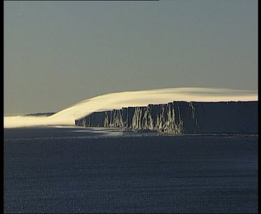 Thick layer of very low cloud over coastal cliffs, like a tablecloth.