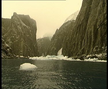 Fjord or sound. Long narrow coastal inlet between tall cliffs.