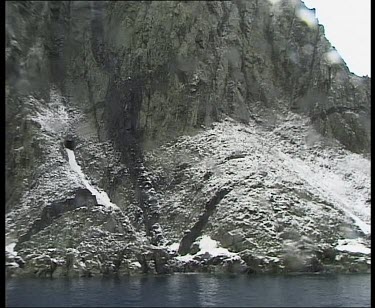 Snow on lower reaches of coastal cliffs