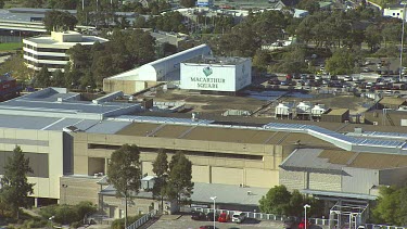Shopping Centre Mall. Parking lot with lots of cars. Medium Shot. Macarthur Square. Outlying suburbs of Sydney.