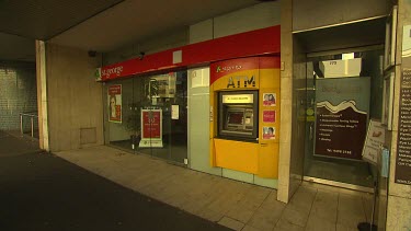 Bank entrance and automatic teller machine.