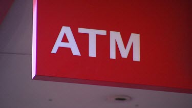 Sign says "ATM". Automatic Teller Machine. Cash machine